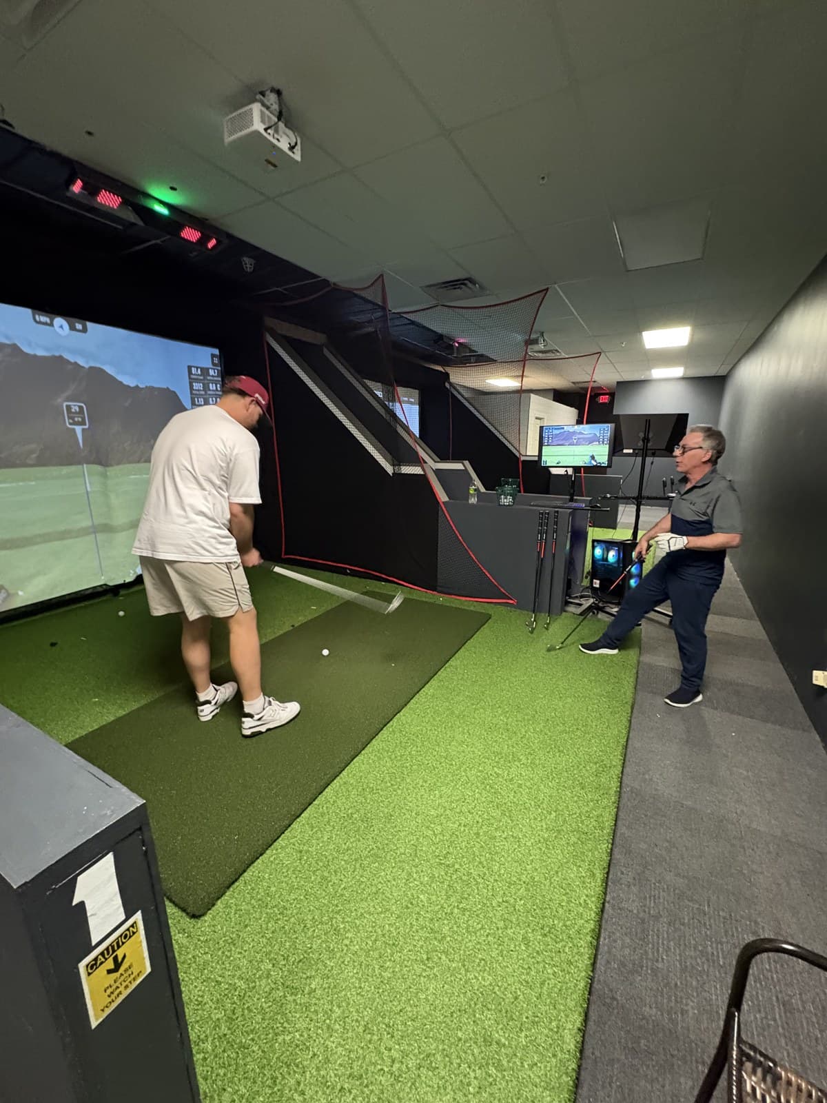 Frank Boe-Risolia coaching a student at SwingStop